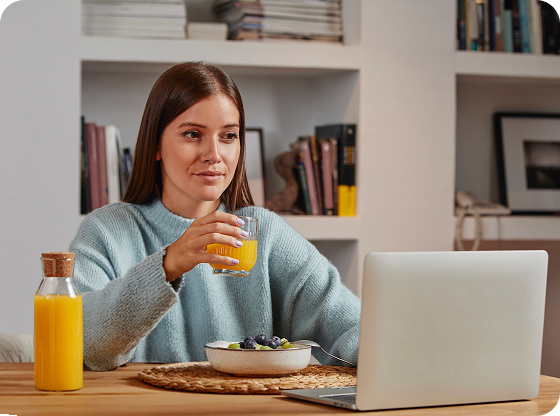 A woman drinking orange juice