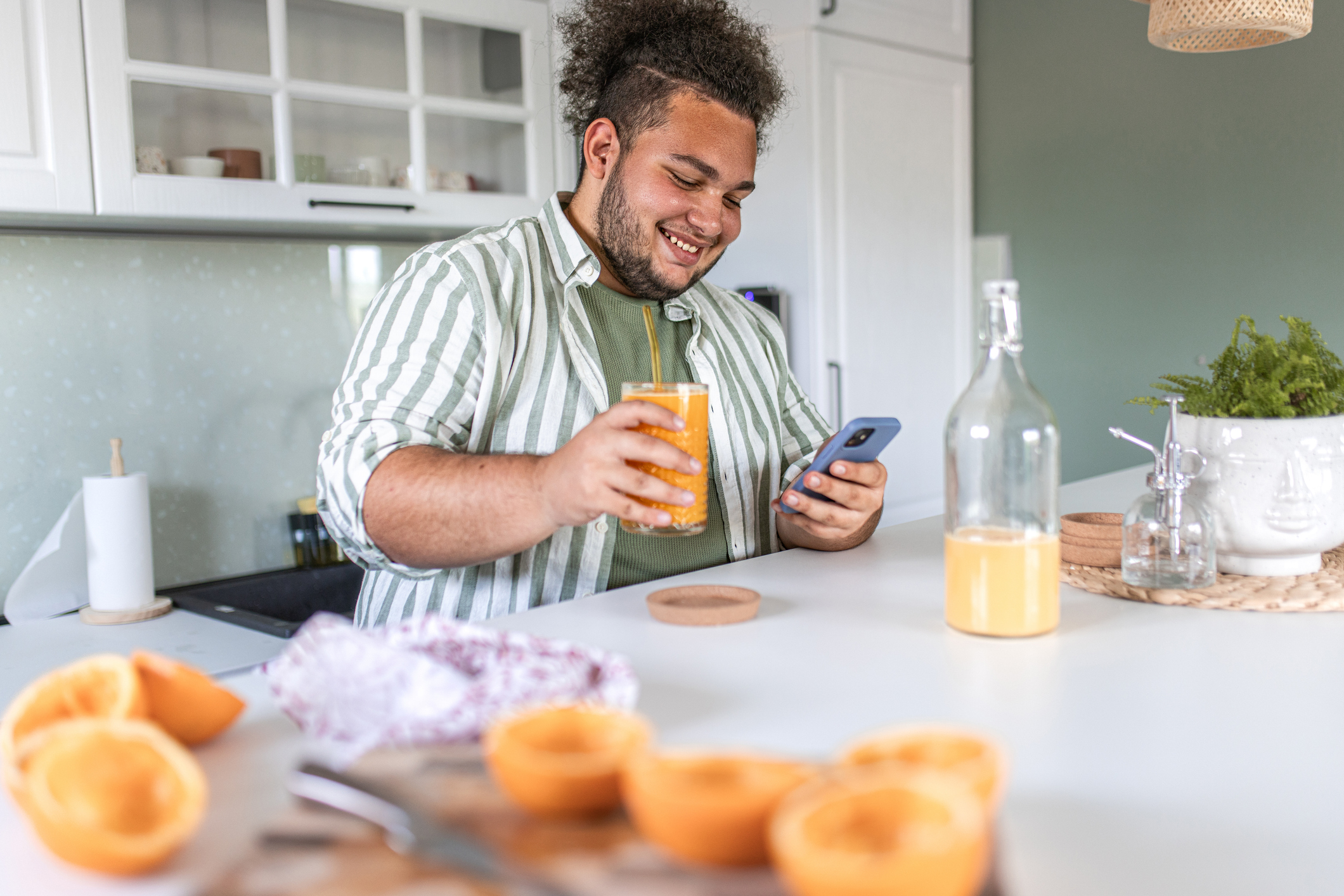 Cheerful young man enjoys morning routine stock photo